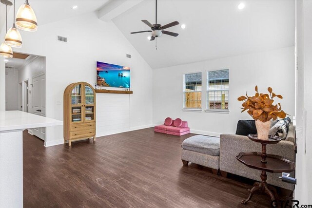 509 Zimmerman Dr, Jacksonville, TX 75766 - living area with ceiling fan, beam ceiling, high vaulted ceiling, baseboards, and dark wood-type flooring