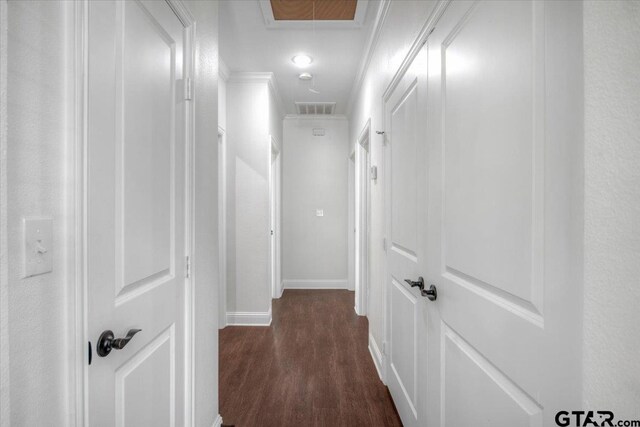 509 Zimmerman Dr, Jacksonville, TX 75766 - hall with ornamental molding, attic access, dark wood finished floors, and visible vents