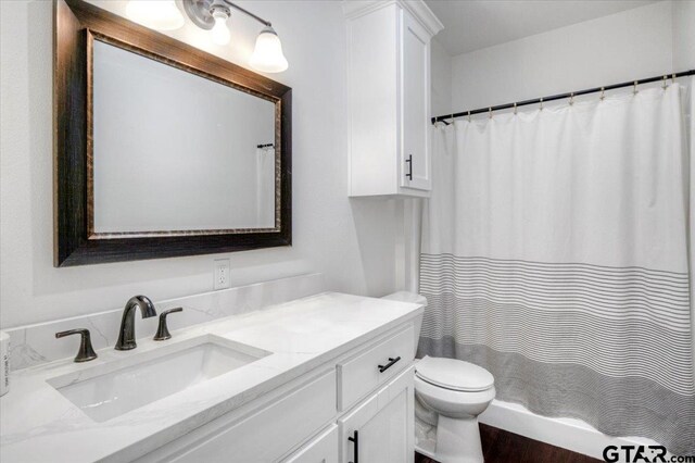 509 Zimmerman Dr, Jacksonville, TX 75766 - bathroom with toilet, a shower with curtain, and vanity