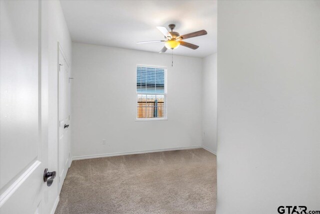 509 Zimmerman Dr, Jacksonville, TX 75766 - carpeted spare room featuring baseboards and ceiling fan