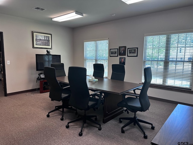 office space featuring baseboards, visible vents, and carpet floors
