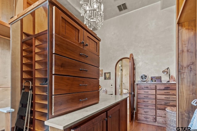 interior space featuring a chandelier and hardwood / wood-style flooring