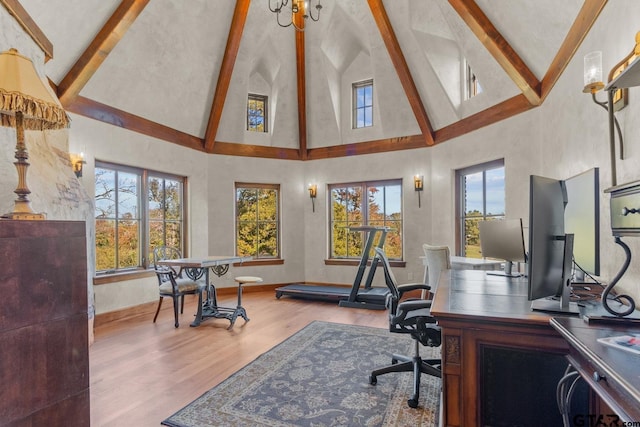 office space featuring high vaulted ceiling, beam ceiling, and wood-type flooring