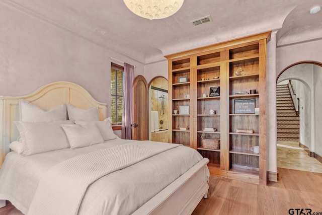 bedroom with light wood-type flooring