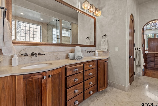 bathroom featuring a wealth of natural light and vanity