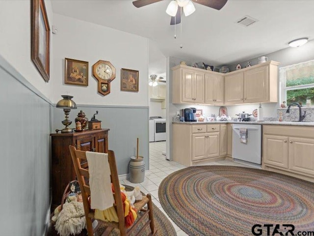 415 Lakeshore Dr, Palestine, TX 75801 - kitchen with light countertops, white dishwasher, a sink, visible vents, and a ceiling fan