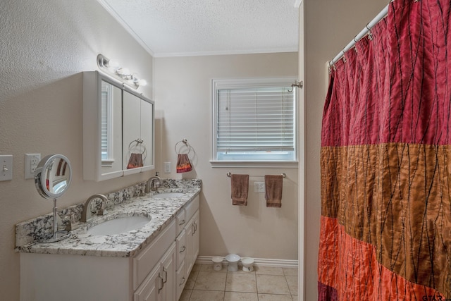 bathroom with a sink, ornamental molding, double vanity, and tile patterned flooring