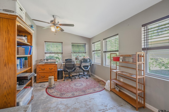 office area featuring ceiling fan, baseboards, lofted ceiling, and plenty of natural light