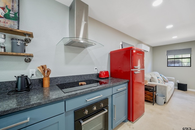 kitchen with wall chimney exhaust hood, black electric cooktop, freestanding refrigerator, wall oven, and recessed lighting