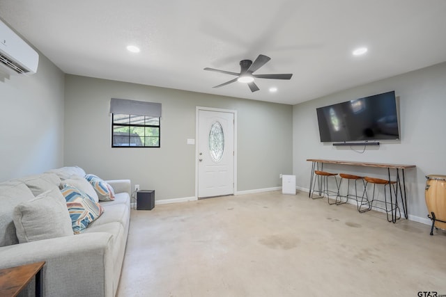 living area featuring baseboards, a wall mounted air conditioner, recessed lighting, a ceiling fan, and concrete flooring