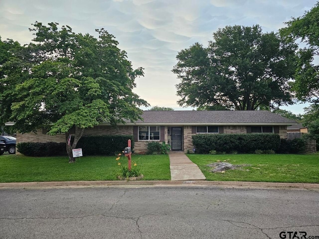 single story home with a front yard