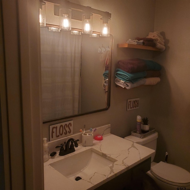 bathroom with vanity and toilet