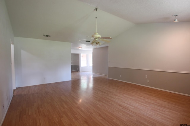 21298 Dogwood Dr, Flint, TX 75762 - unfurnished room with ceiling fan, light wood-style floors, vaulted ceiling, and baseboards