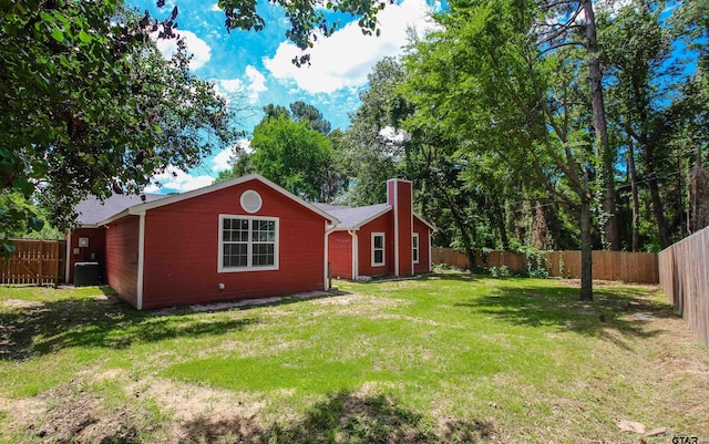 21298 Dogwood Dr, Flint, TX 75762 - back of property featuring a chimney and central AC