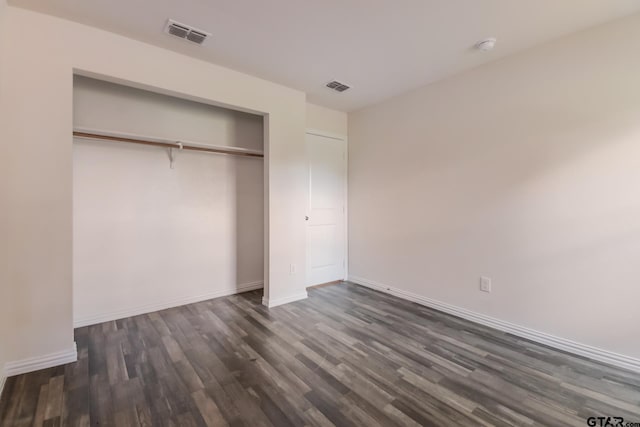 2525 N Tenneha Ave, Tyler, TX 75702 - unfurnished bedroom with dark wood-type flooring and a closet