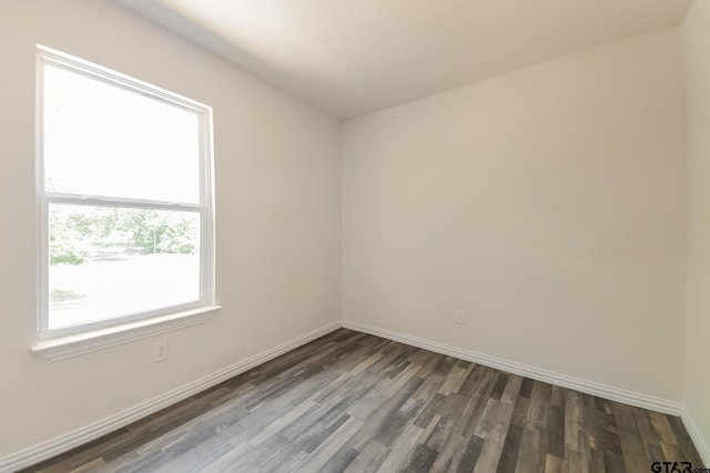 2525 N Tenneha Ave, Tyler, TX 75702 - spare room with wood finished floors and baseboards