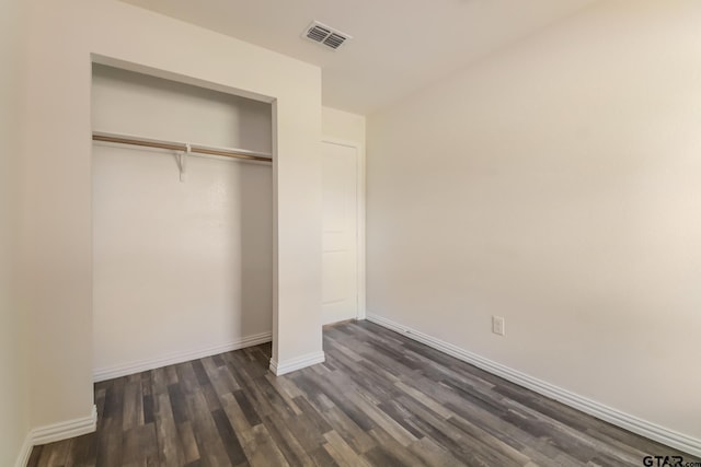 2525 N Tenneha Ave, Tyler, TX 75702 - unfurnished bedroom with dark wood-type flooring and a closet