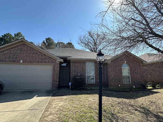 single story home featuring brick siding, concrete driveway, and a garage