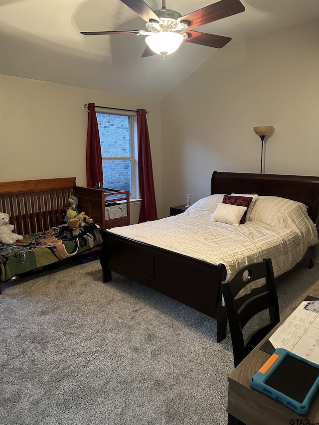 carpeted bedroom featuring vaulted ceiling and a ceiling fan