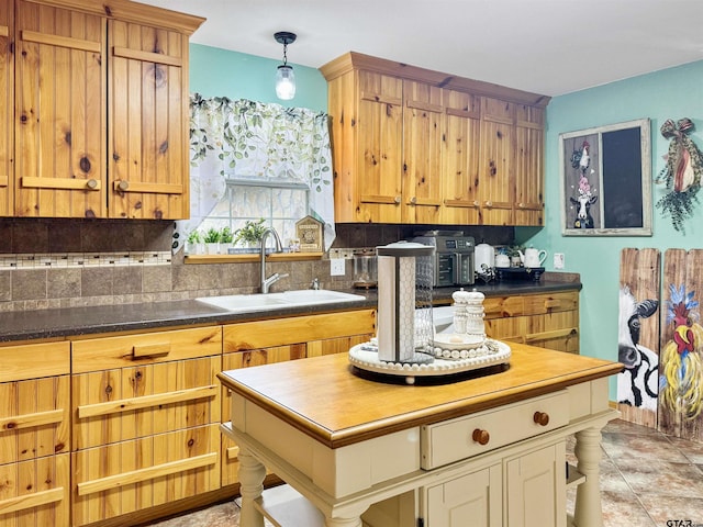 15250 Fm 858, Athens, TX 75752 - kitchen with a sink, tasteful backsplash, dark countertops, and a kitchen island