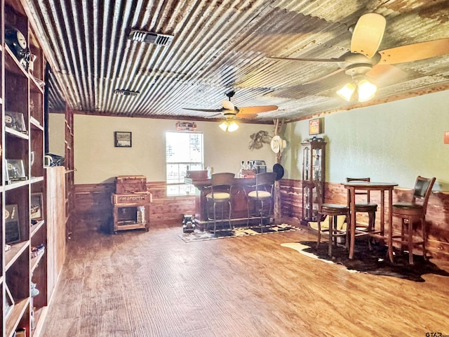 15250 Fm 858, Athens, TX 75752 - dining area featuring wood finished floors, wainscoting, and ceiling fan