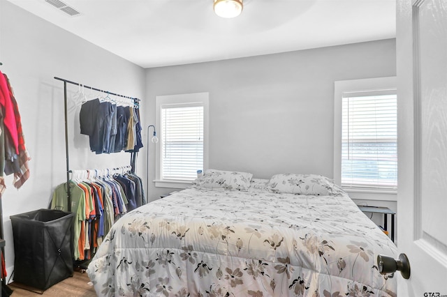 bedroom with multiple windows