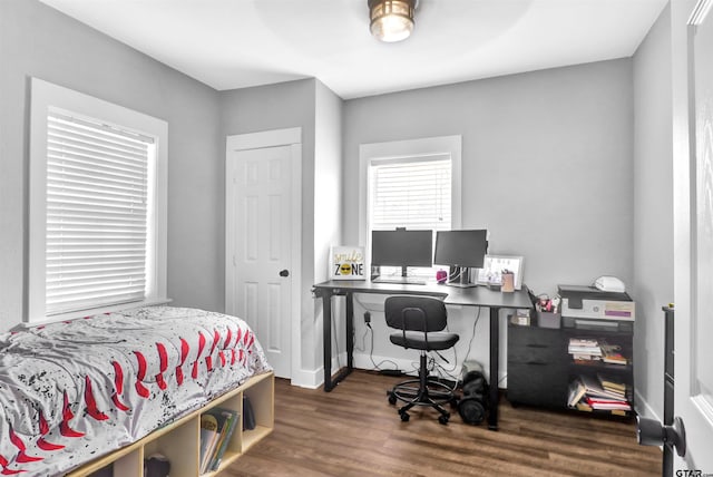 bedroom featuring dark hardwood / wood-style floors and ceiling fan