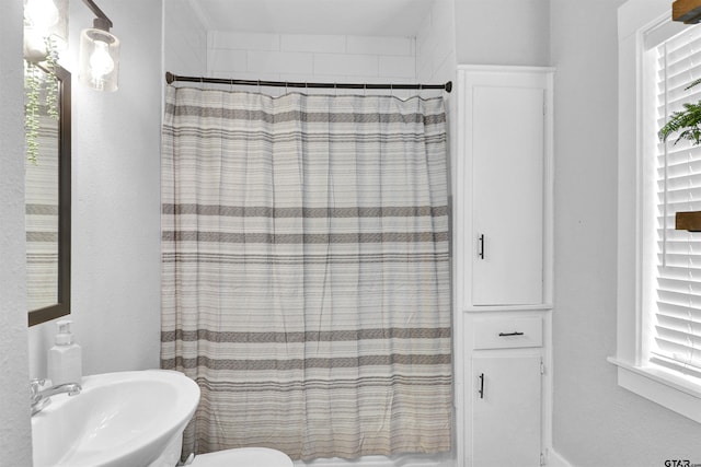 bathroom featuring sink and toilet