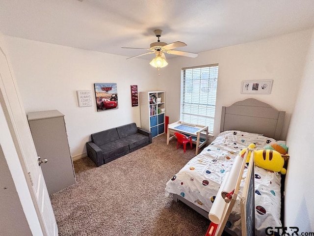 bedroom featuring carpet floors, baseboards, and a ceiling fan