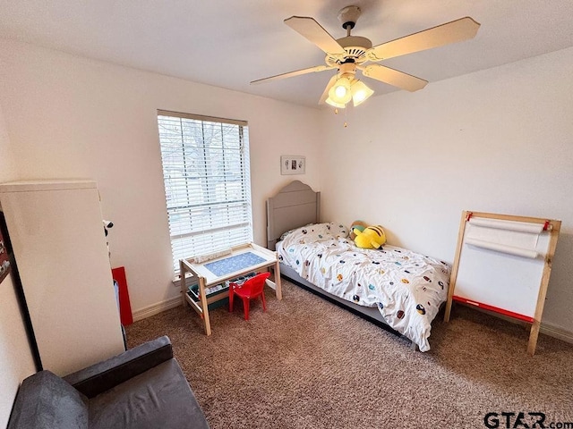 bedroom with carpet floors, ceiling fan, and baseboards