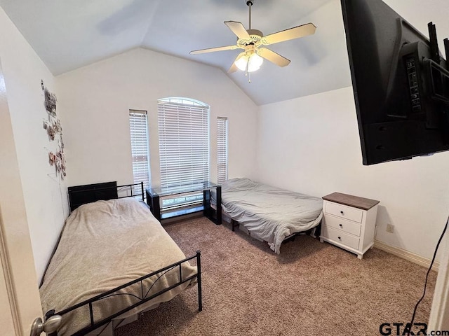 bedroom featuring vaulted ceiling, carpet floors, a ceiling fan, and baseboards