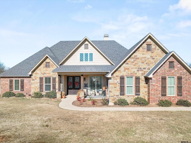 11087 Wolverine Rd, Pittsburg, TX 75686 - craftsman inspired home with a shingled roof, french doors, stone siding, a chimney, and a front yard