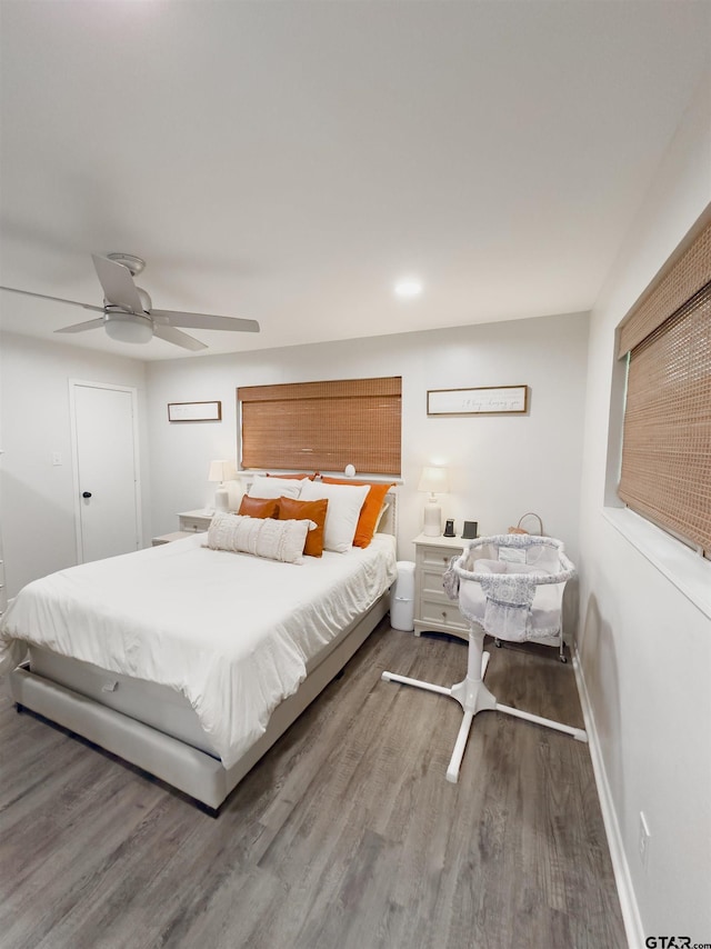 8116 Jewell Ln, Tyler, TX 75703 - bedroom with wood finished floors, a ceiling fan, and baseboards