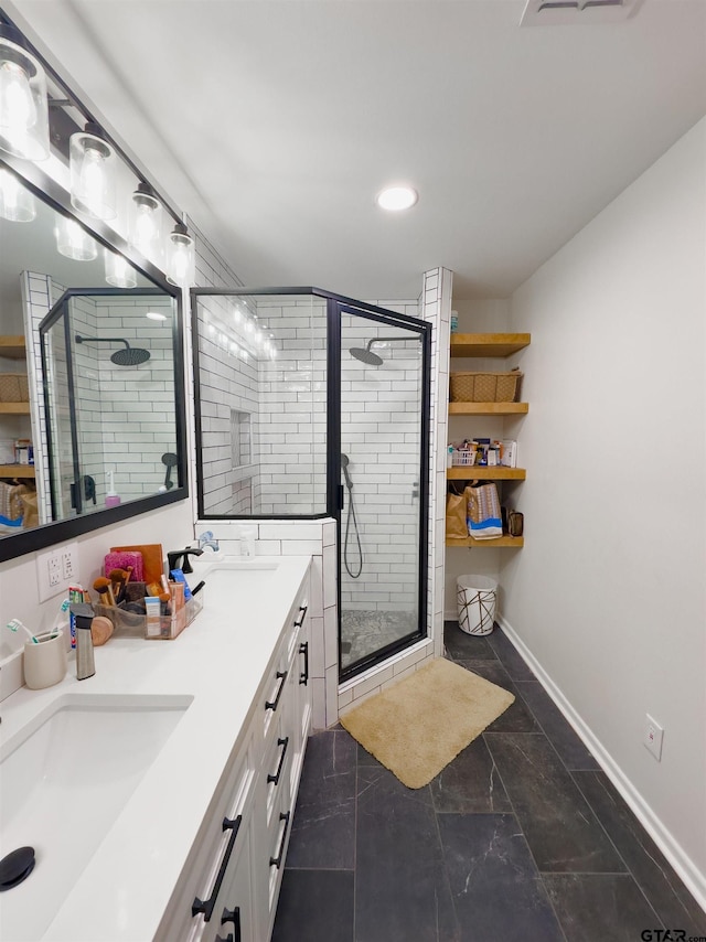 8116 Jewell Ln, Tyler, TX 75703 - full bathroom with a stall shower, baseboards, double vanity, recessed lighting, and marble look tile flooring