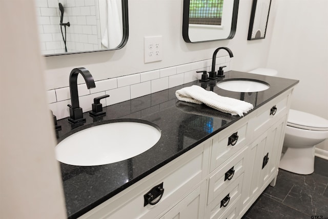 8116 Jewell Ln, Tyler, TX 75703 - full bath with toilet, double vanity, decorative backsplash, and marble finish floors