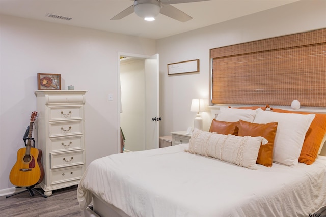 8116 Jewell Ln, Tyler, TX 75703 - bedroom with wood finished floors, baseboards, and a ceiling fan
