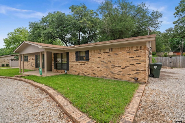 8116 Jewell Ln, Tyler, TX 75703 - back of house featuring brick siding and a patio