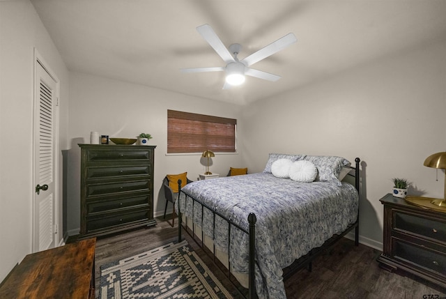 8116 Jewell Ln, Tyler, TX 75703 - bedroom featuring dark wood-type flooring, baseboards, ceiling fan, and a closet