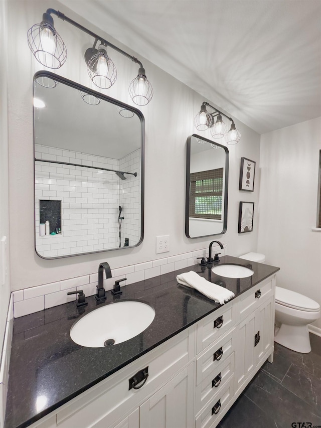 8116 Jewell Ln, Tyler, TX 75703 - full bath featuring toilet, double vanity, a tile shower, and marble look tile flooring