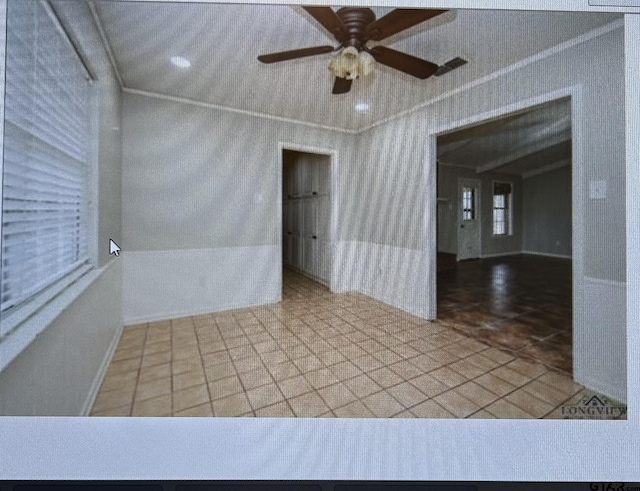 3729 Linda Kaye Dr, Longview, TX 75604 - unfurnished room featuring baseboards, crown molding, a ceiling fan, and wallpapered walls