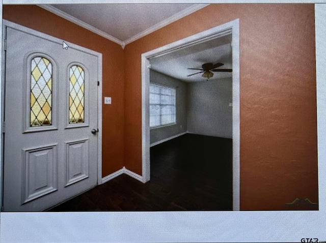 3729 Linda Kaye Dr, Longview, TX 75604 - entryway featuring a ceiling fan, dark wood-style floors, crown molding, and baseboards