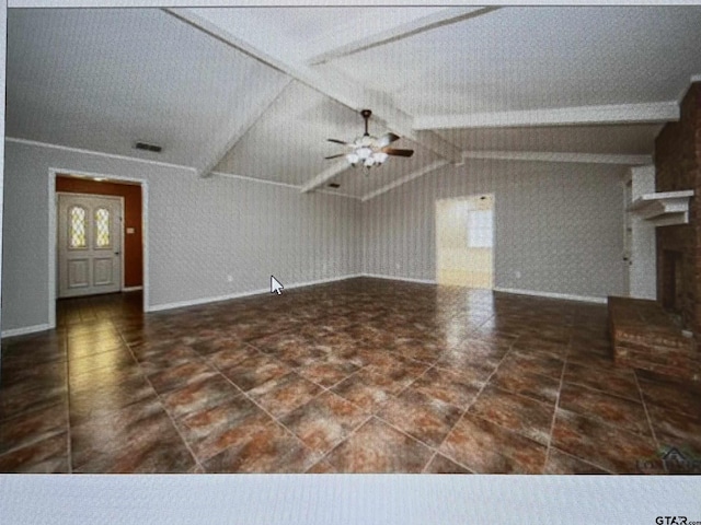 3729 Linda Kaye Dr, Longview, TX 75604 - unfurnished living room featuring a brick fireplace, vaulted ceiling with beams, baseboards, and a ceiling fan