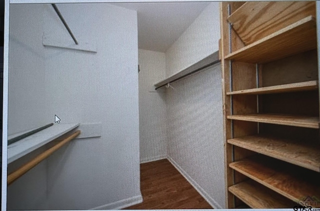 3729 Linda Kaye Dr, Longview, TX 75604 - walk in closet featuring dark wood-style flooring