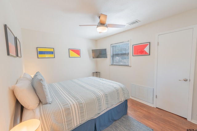 bedroom featuring hardwood / wood-style flooring and ceiling fan