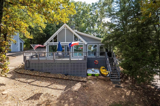 rear view of property with a deck