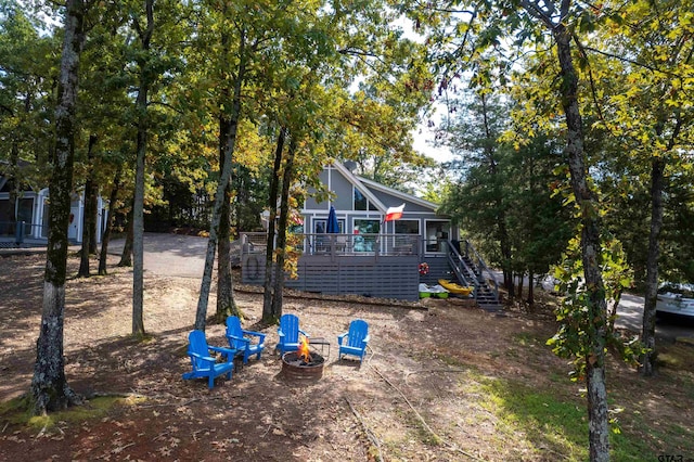 view of yard with an outdoor fire pit