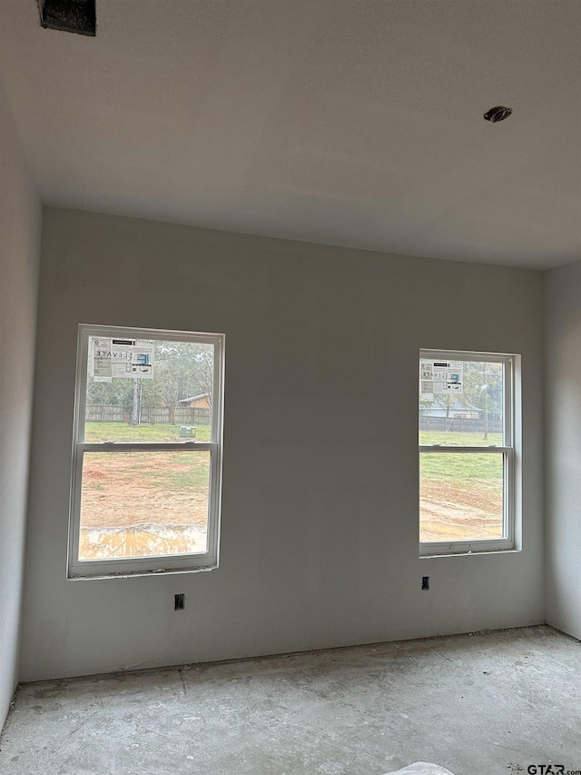 unfurnished room featuring a healthy amount of sunlight