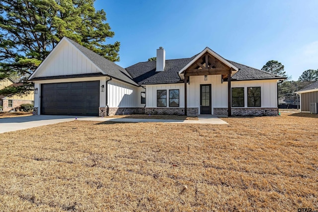 modern farmhouse style home with a garage and a front yard