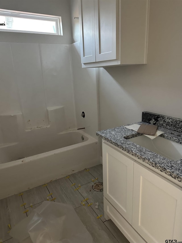 bathroom featuring vanity and shower / bathtub combination