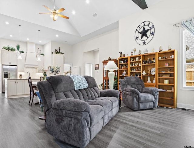 9109 Long Br, Tyler, TX 75703 - living area with dark wood-type flooring, ceiling fan, recessed lighting, and high vaulted ceiling